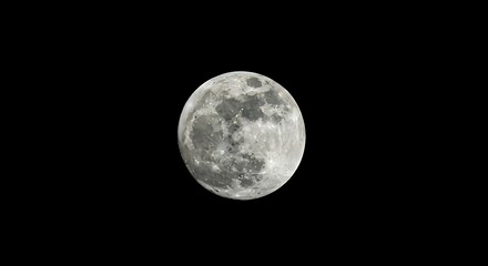 Fototapeta premium A close-up view of the full moon set against a dark, starless, night sky