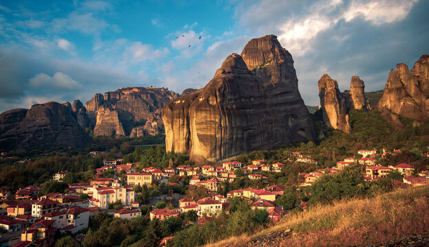 Village of Kastraki Nestled Under Giant Meteora Rock Formations at Sunset