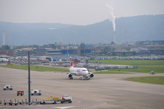 Swiss passenger airplane Airbus A320-214 registration HB-IJR pushback at Swiss Z&uuml;rich Airport on a gray autumn day. Photo taken October 3rd, 2025, Zurich Airport, Switzerland.