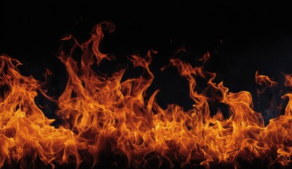 Obraz premium Intense flames dance against a stark black backdrop, creating a fiery, dynamic scene