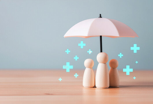 Conceptual image of a wooden family group under an umbrella, representing comprehensive health insurance, medical care, and robust protection against unforeseen risks