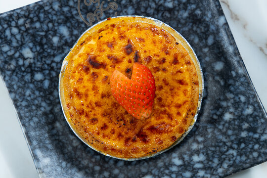 Classic creme brulee dessert with strawberry