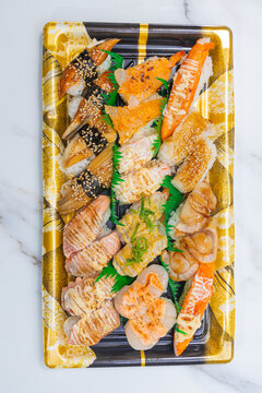 Assorted seared sushi nigiri on party tray