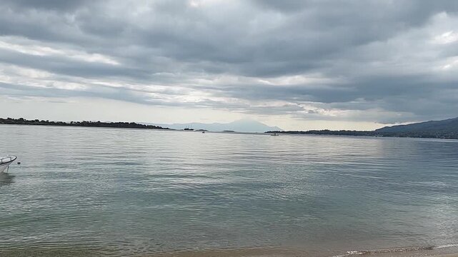 Clouds over the sea in Halkidiki, Greece. In the distance you can see Olimpus Mountain.