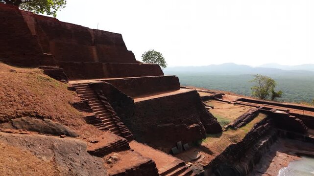Water collects in a depression among the ruins of the Palace at Sigiriya Rock in Sri Lanka