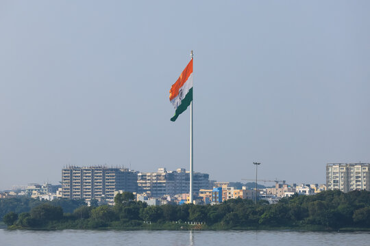 India national flag flying cityscape background in Hyderabad, India