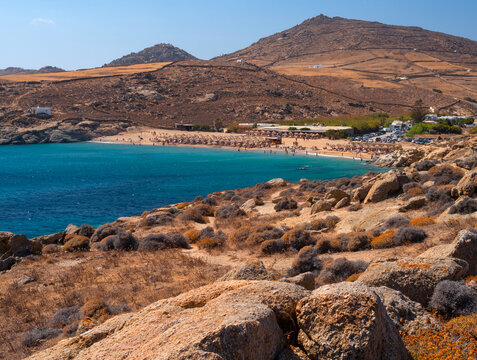 Panoramic view of Lia beach with tourists on the island of Mykonos in Greece.