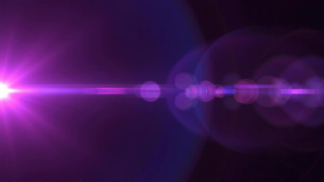 Elegant lens flare on black backdrop concept. Bright purple light flare effect with glowing bokeh on dark background for digital design