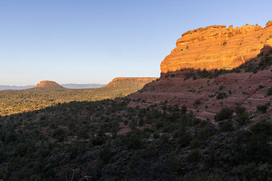Partial shadow on sheer red rock cliff in Sedona landscape