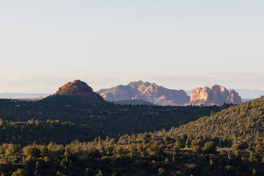 Forested landscape and jagged rock formations in Sedona