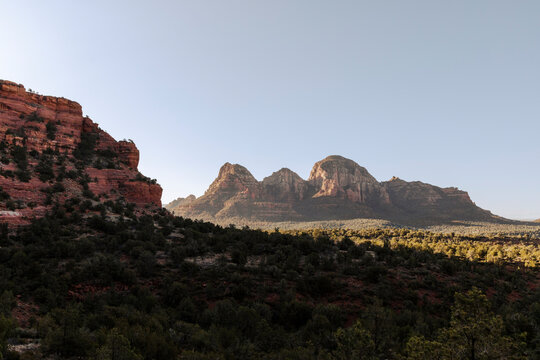 Rock formations in forested desert landscape
