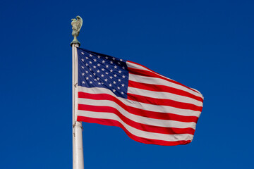 Obraz premium Flag American waving in clear horizon. American patriotic freedom banner on flag. USA democracy liberty symbol in flag. American independence culture on flag.