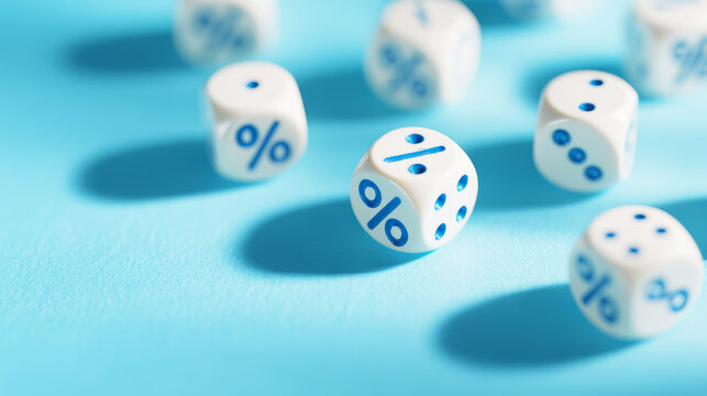 White dice with blue percentage and division symbols creating shadows on a bright blue background, representing financial concepts and probability