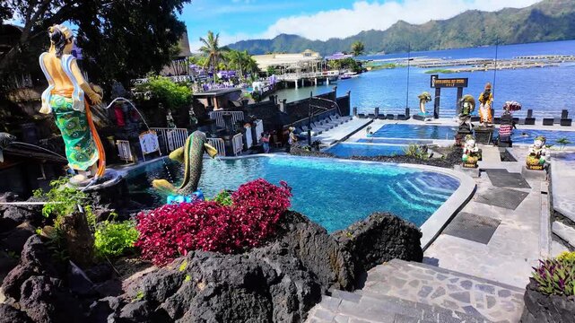 Natural geothermal hot spring pools overlooking Lake Batur and volcanic landscape in Kintamani Bali Indonesia #02