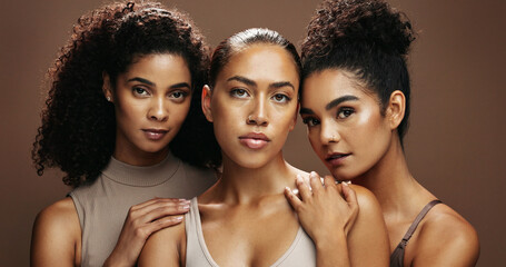 Obraz premium Portrait, group or friends with skincare in studio, natural cosmetics or confident for self care together. Dermatology, wellness or women with support for glowing skin, beauty or brown background