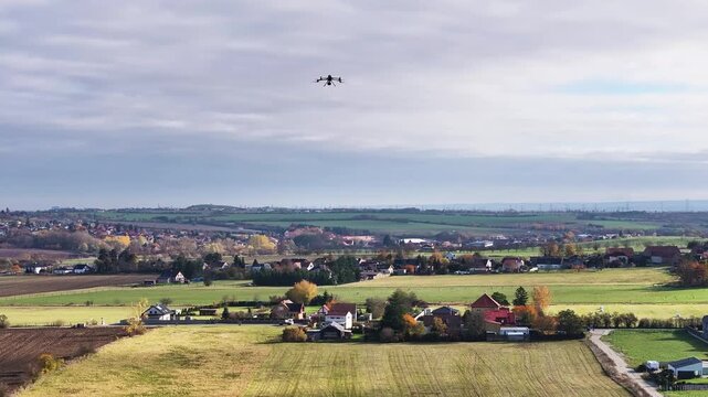 LiDAR drone flying scan mission over rural area, aerial view