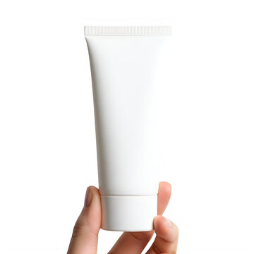 Hand holding white tube of skincare cream close-up isolated on transparent background