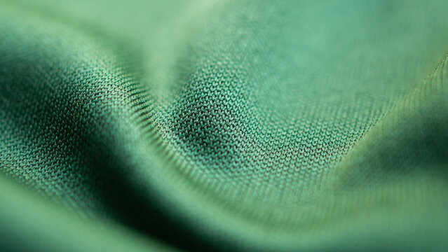 Green sports clothing fabric football shirt jersey texture close up