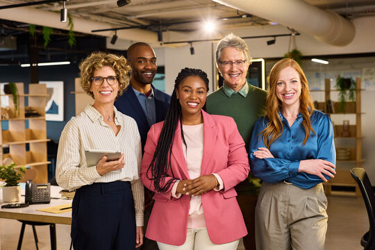 Portrait of happy multiethnic business team in office