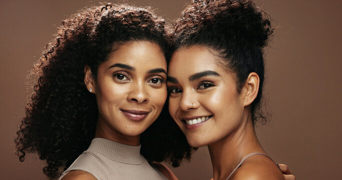 Portrait, women and smile in studio with skincare, bonding together and makeup for beauty aesthetic. Happy, friends and confident with glowing skin, cosmetics and dermatology on brown background.