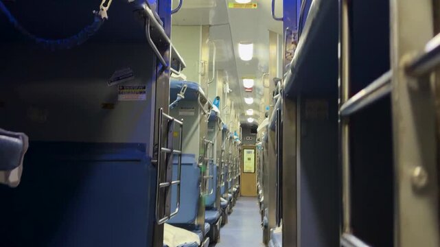 indian train 3ac coach interior with bunk beds and aisle