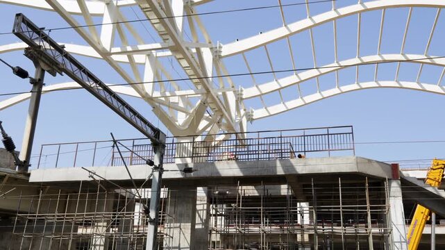 engineering structure with white steel framework and scaffolding