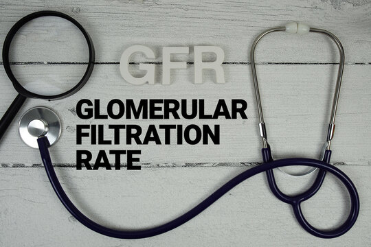 GFR Glomerular Filtration Rate text with Stethoscope on wooden background