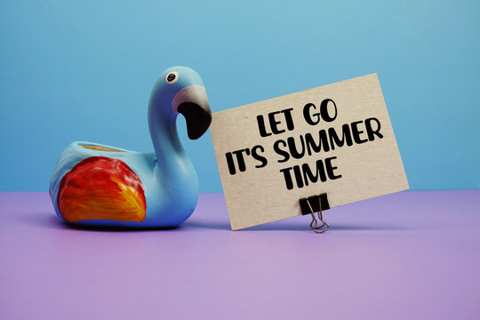 Let Go It's Summer Time text with famingo figure on blue and purple background