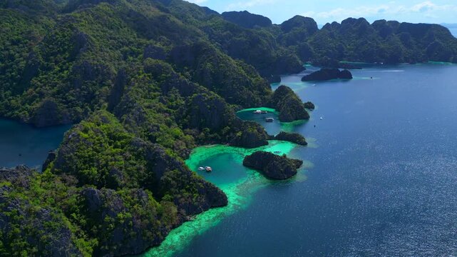 Coron Lagoon with limestone karsts turquoise waters. Lovely aerial view drone