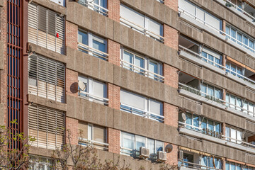 Fototapeta premium Residential Apartment Building Facade with Concrete and Brick Details