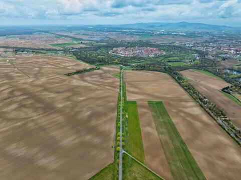 Aerial view of the star-shaped fortress city, a testament to military architecture amidst the agricultural fields, Neuf-Brisach, Grand Est, France.