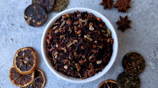 Dry herbal or fruit tea with flower petals and aromatic additives. Dry fruit herbal tea as a background for your design