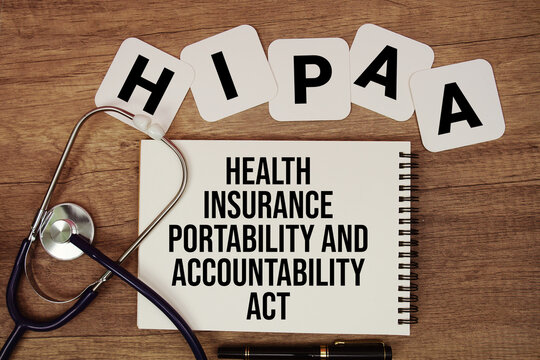 HIPAA Health Insurance Portability and Accountability Act text written on notepad with stethoscope on wooden background