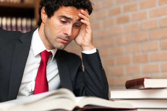 Exhausted businessman overwhelmed with work