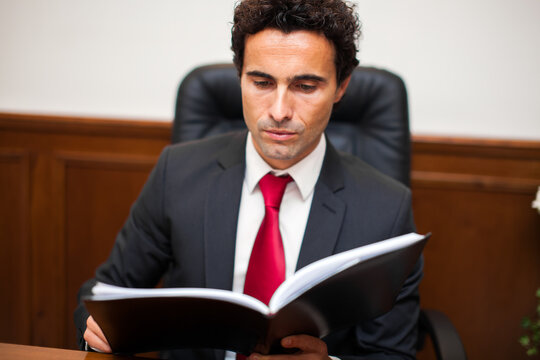 Professional lawyer reviewing legal documents