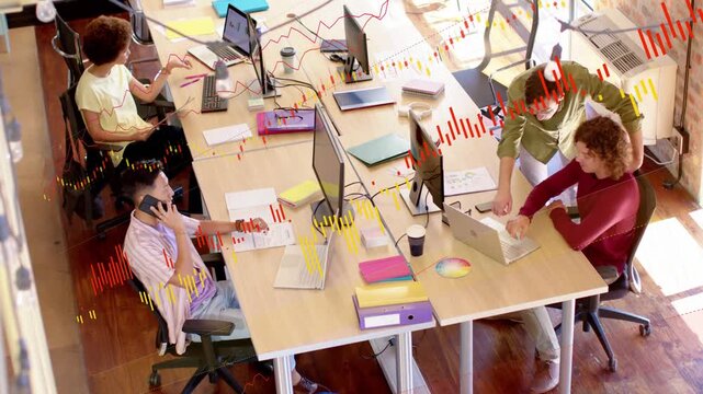 Business team pointing at laptop, consulting charts, phoning while animated metrics overlaying desk