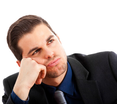 Young man in a business suit with a contemplative expression