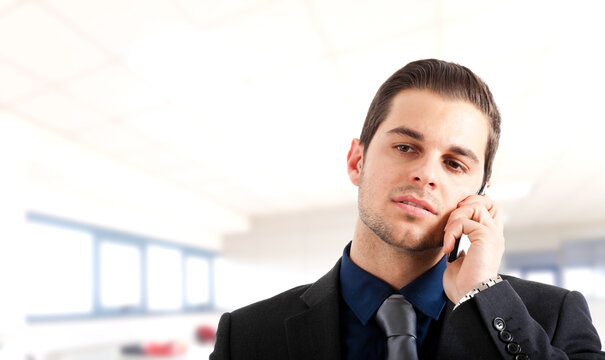 Confident businessman making a phone call