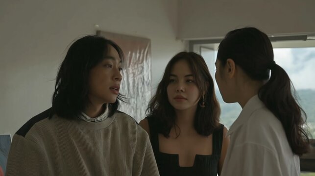 Three women having intense conversation indoors expressing emotions and interpersonal relationships dynamic