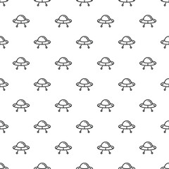 Obraz premium Flying saucer alien spacecraft creating a seamless pattern background