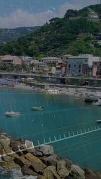 Vertical video: Camera panning coast, causing mapping overlays for route view with grid, green path