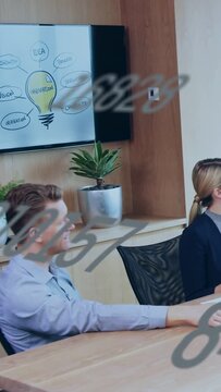 Vertical video: Man turning and smiling as idea slide and numbers drifting over faces in business