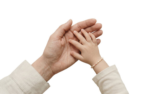 Close up of mother and baby hands touching on isolated background, hands holding hands together,