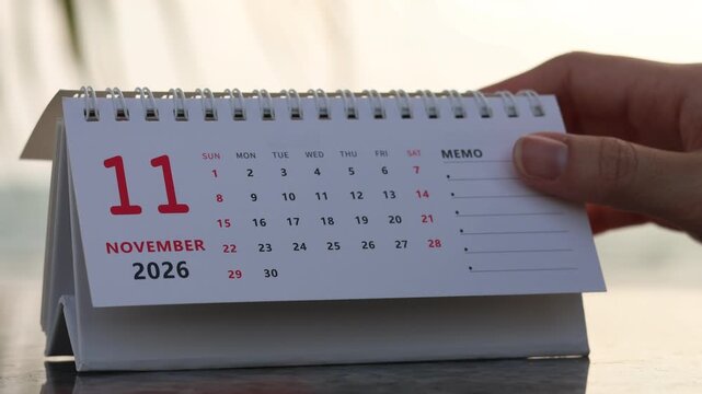Footage horizontal of flip calendar pages for change months from October to November of the year 2026. concept of planning and starting a new month. 4k