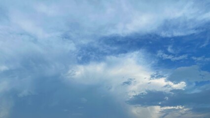 Obraz premium Cloudy Blue Sky Background with Dramatic Clouds and Soft Light Copy Space