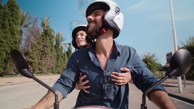Video of beautiful and happy couple riding around the city on a motorbike
