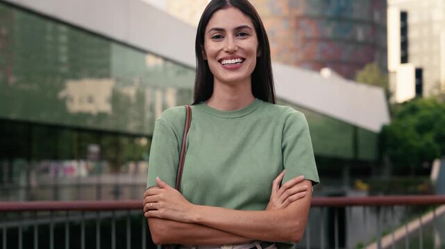 Video of modern woman posing and looking at camera in the city