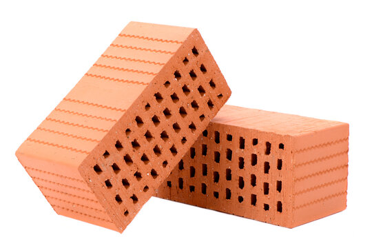 Symbolbild f&uuml;r Wohnungsbau mit Ziegelstein und Werkzeug