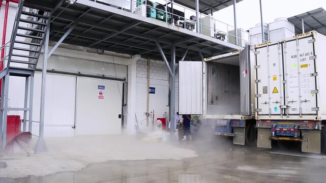 Slow Pan Left Revealing Open Refrigerated Shipping Container with Cold Fog at Loading Dock - 60fps