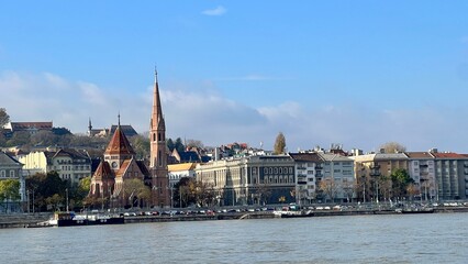 Fototapeta premium Budapest cityscape along danube river with church spire